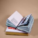 open book on top of several stacked books